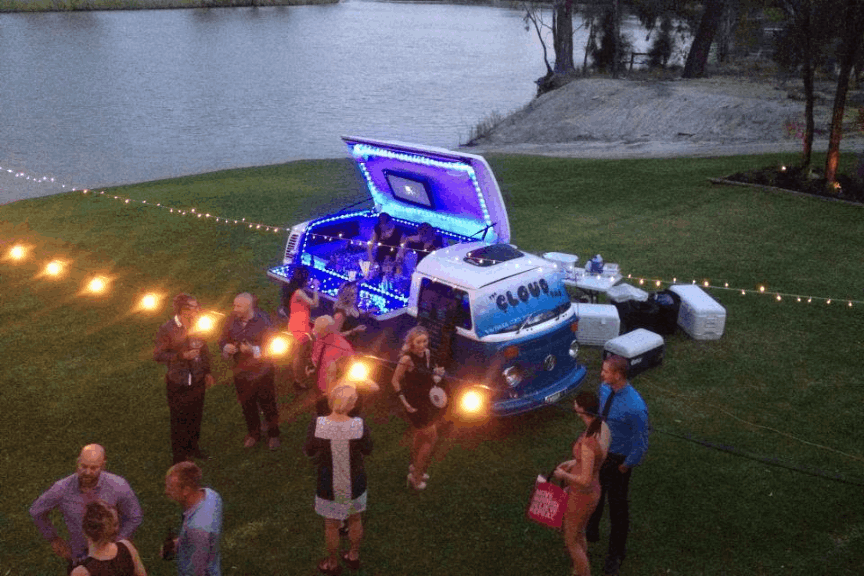 VW Bar's mobile bar catering a wedding held near a lake for its venue.
